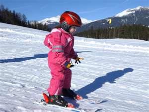 Child skiing downhill